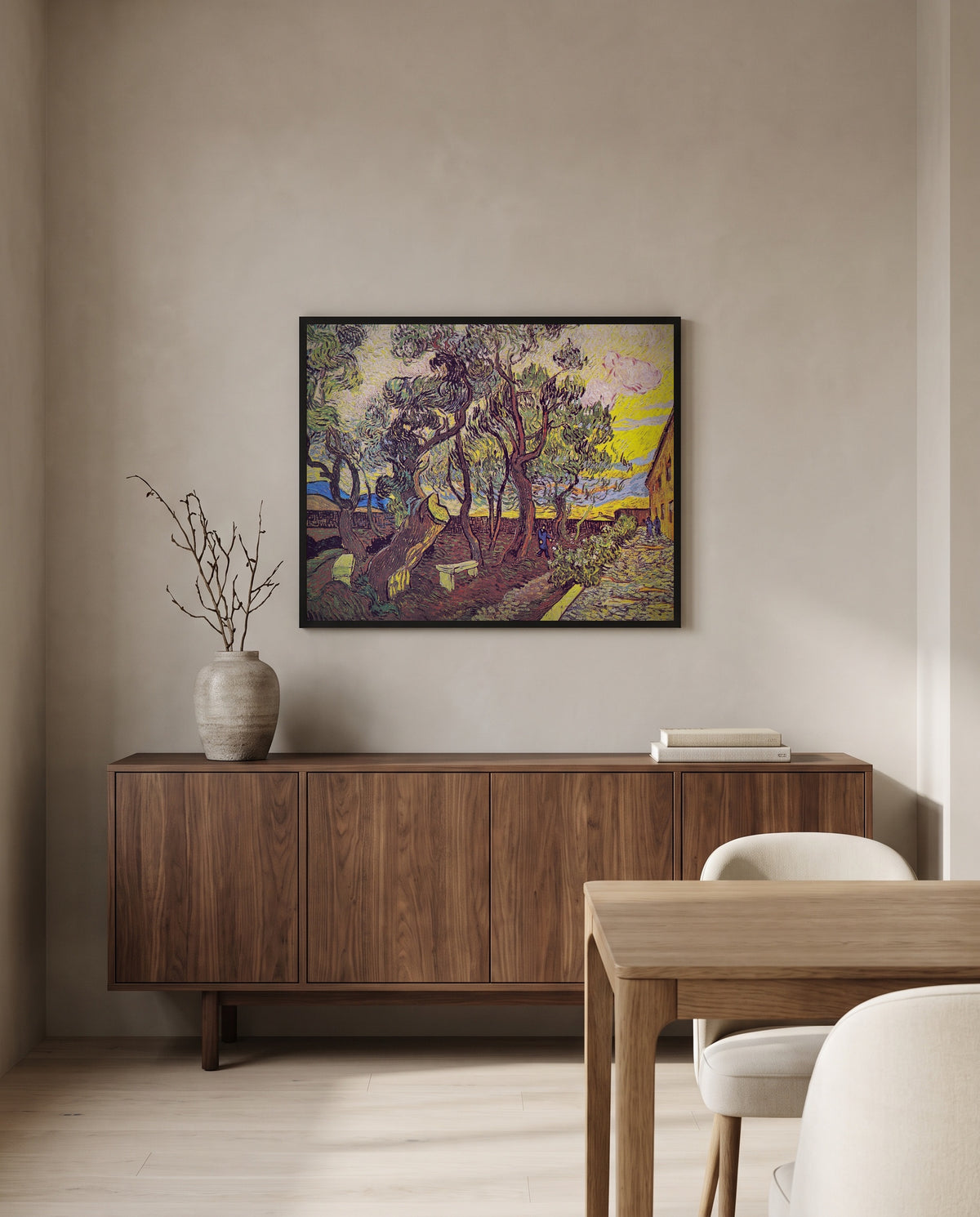 Garden of Saint Paul’s Hospital by Vincent van Gogh in a black frame above a walnut sideboard in a dining room