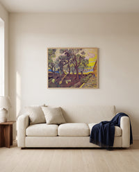 Garden of Saint Paul’s Hospital by Vincent van Gogh framed in natural oak above a cream sofa in a warm living room