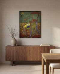 Gauguin’s Armchair by Vincent van Gogh in a black frame above a walnut sideboard in a dining room
