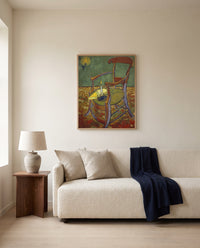 Gauguin’s Armchair by Vincent van Gogh framed in natural oak above a cream sofa in a warm living room