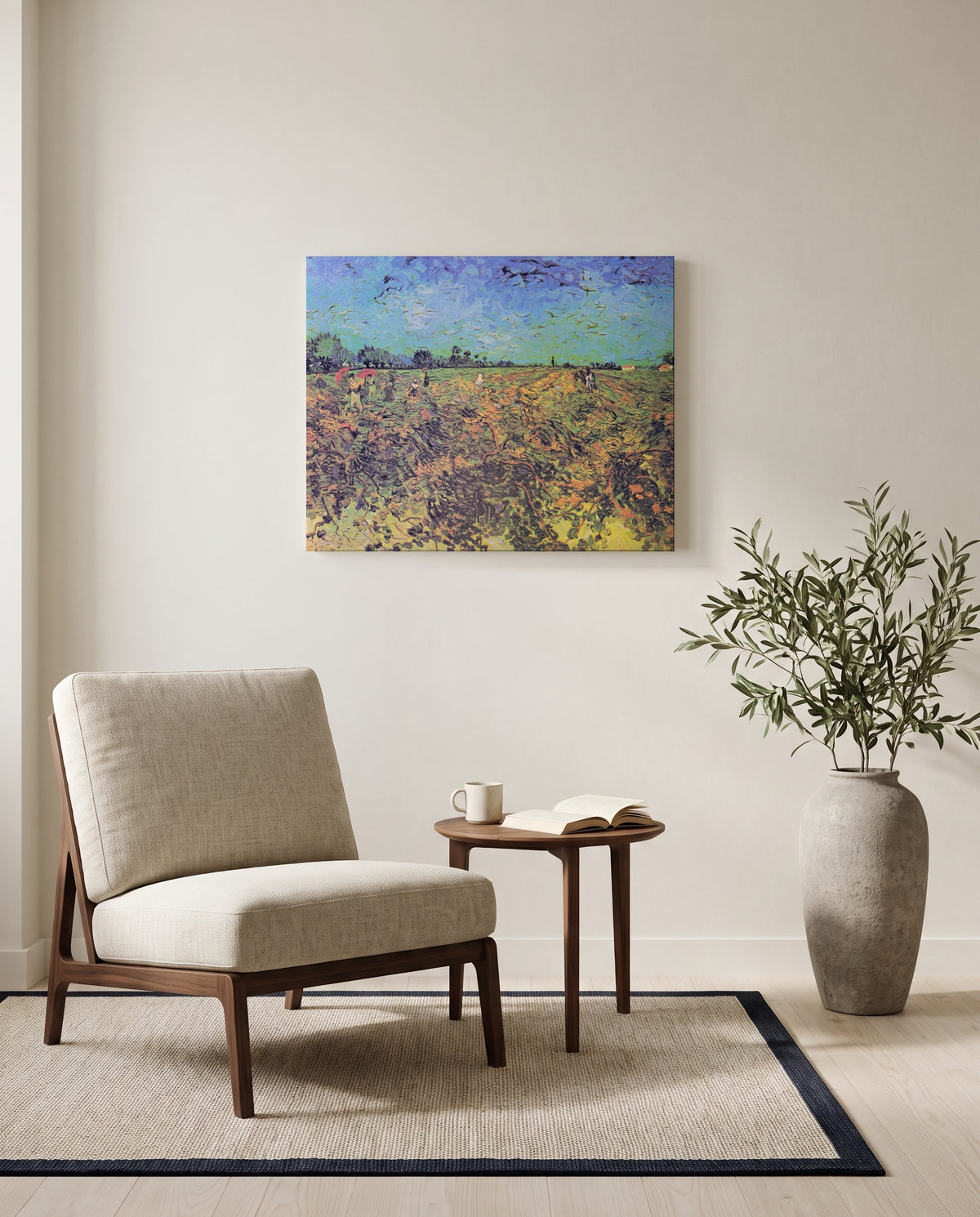 The Green Vineyard by Vincent van Gogh as a stretched canvas above a linen lounge chair in a reading corner