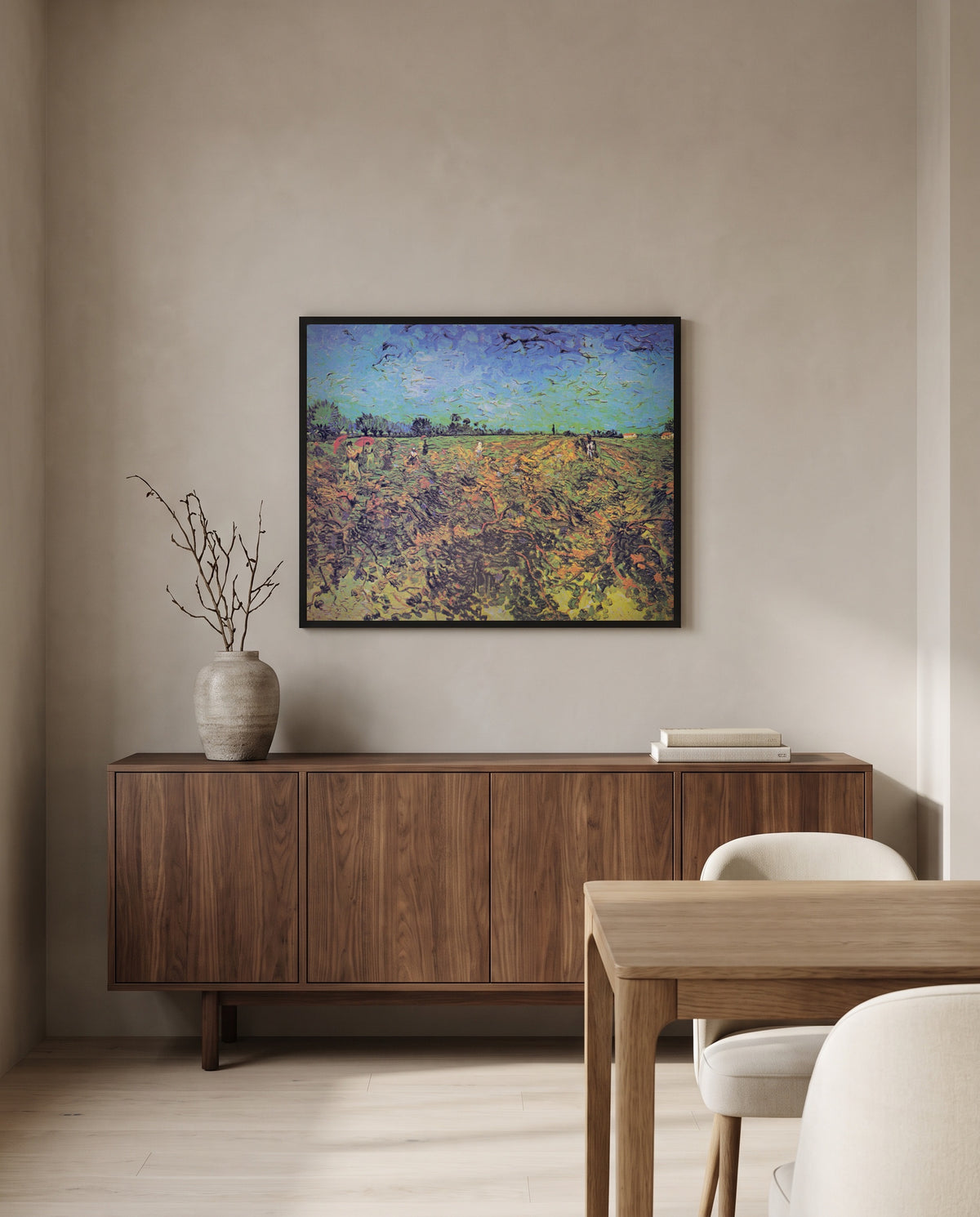 The Green Vineyard by Vincent van Gogh in a black frame above a walnut sideboard in a dining room