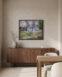 Houses at Auvers by Vincent van Gogh in a black frame above a walnut sideboard in a dining room