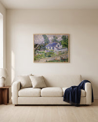 Houses at Auvers by Vincent van Gogh framed in natural oak above a cream sofa in a warm living room
