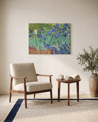Irises by Vincent van Gogh as a stretched canvas above a linen lounge chair in a reading corner