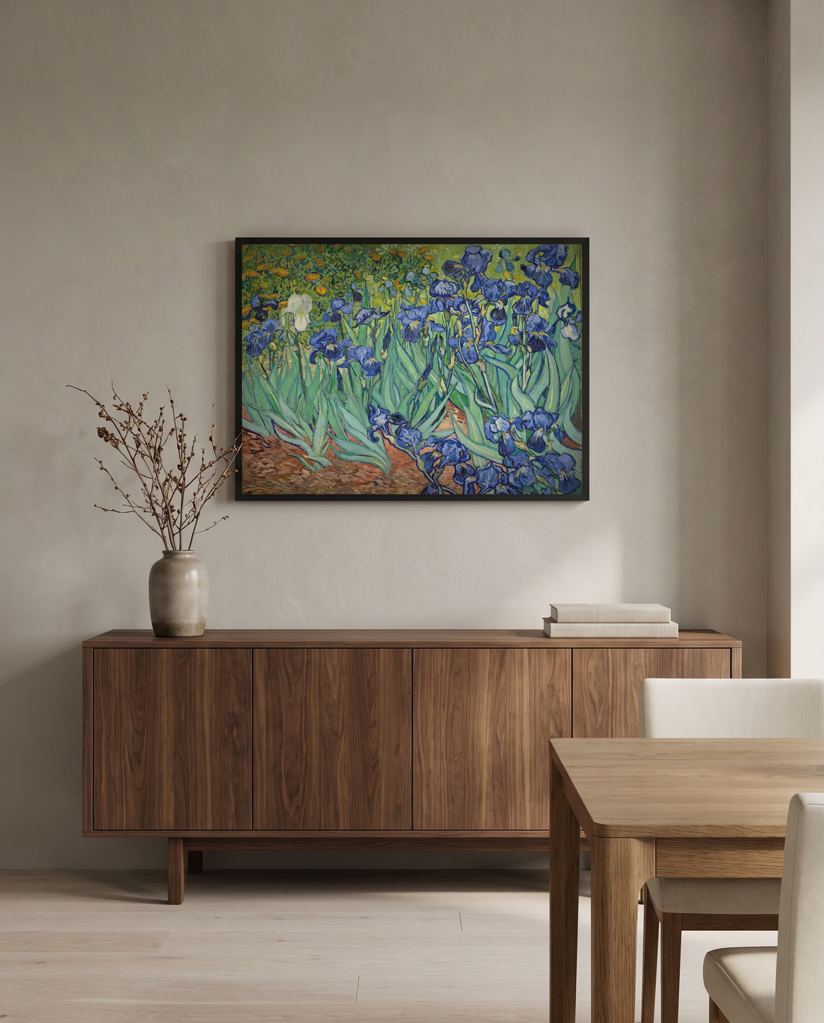 Irises by Vincent van Gogh in a black frame above a walnut sideboard in a dining room