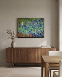 Irises by Vincent van Gogh in a black frame above a walnut sideboard in a dining room
