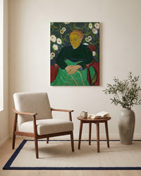 La Berceuse by Vincent van Gogh as a stretched canvas above a linen lounge chair in a reading corner