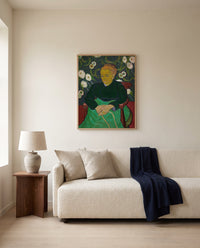 La Berceuse by Vincent van Gogh framed in natural oak above a cream sofa in a warm living room