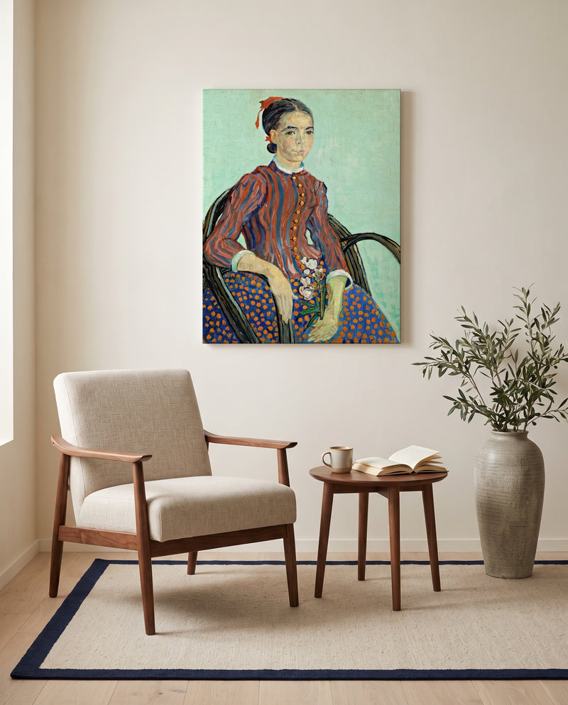 La Mousmé by Vincent van Gogh as a stretched canvas above a linen lounge chair in a reading corner
