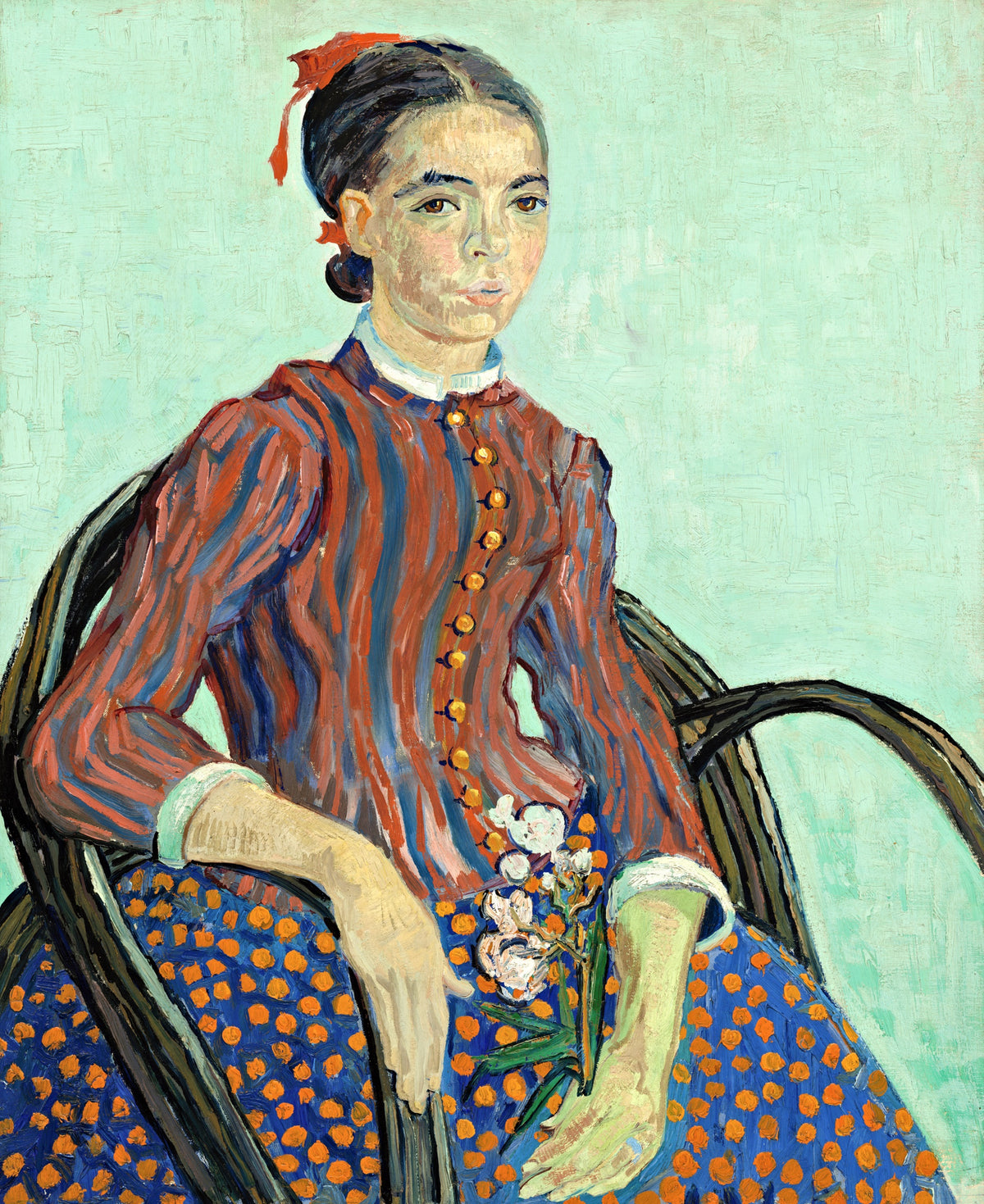 La Mousmé by Vincent van Gogh: a girl in a striped jacket and spotted skirt in a cane chair, holding oleander, on pale green