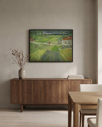Carriage and Train by Vincent van Gogh in a black frame above a walnut sideboard in a dining room
