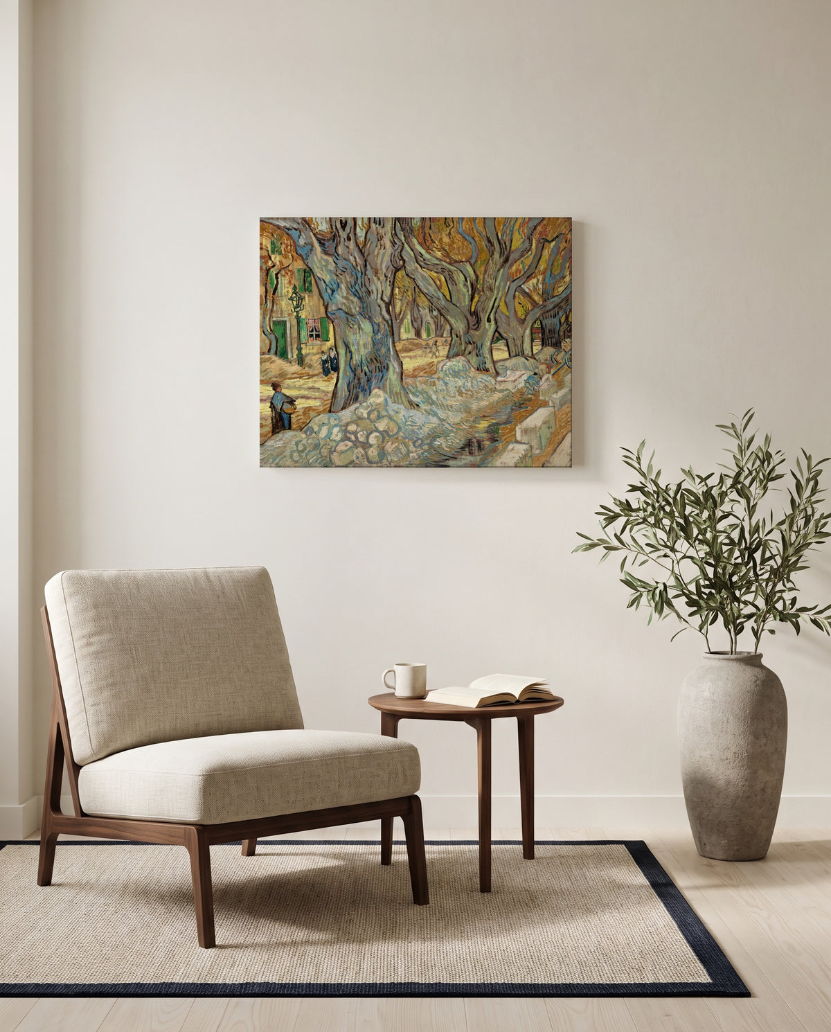The Large Plane Trees by Vincent van Gogh as a stretched canvas above a linen lounge chair in a reading corner