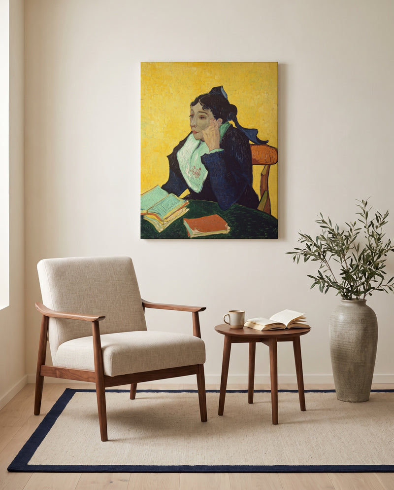 L’Arlésienne by Vincent van Gogh as a stretched canvas above a linen lounge chair in a reading corner