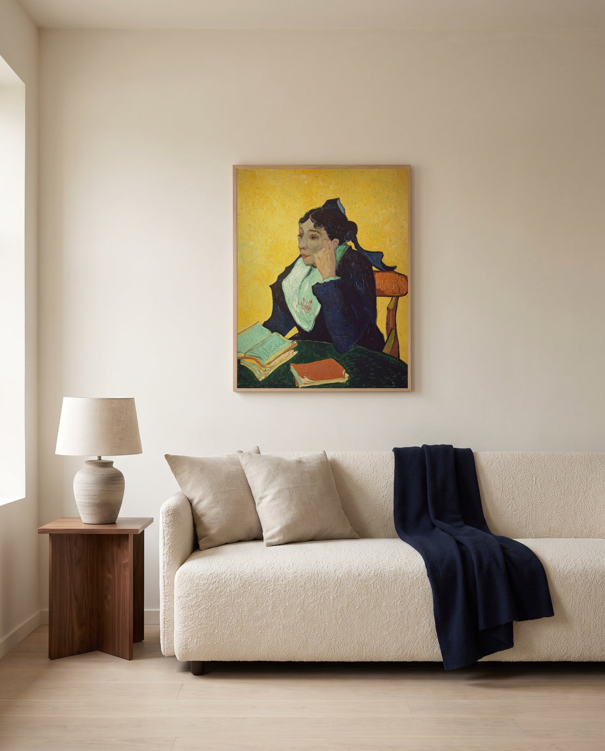 L’Arlésienne by Vincent van Gogh framed in natural oak above a cream sofa in a warm living room