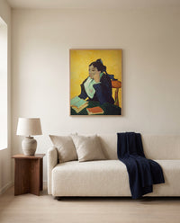 L’Arlésienne by Vincent van Gogh framed in natural oak above a cream sofa in a warm living room