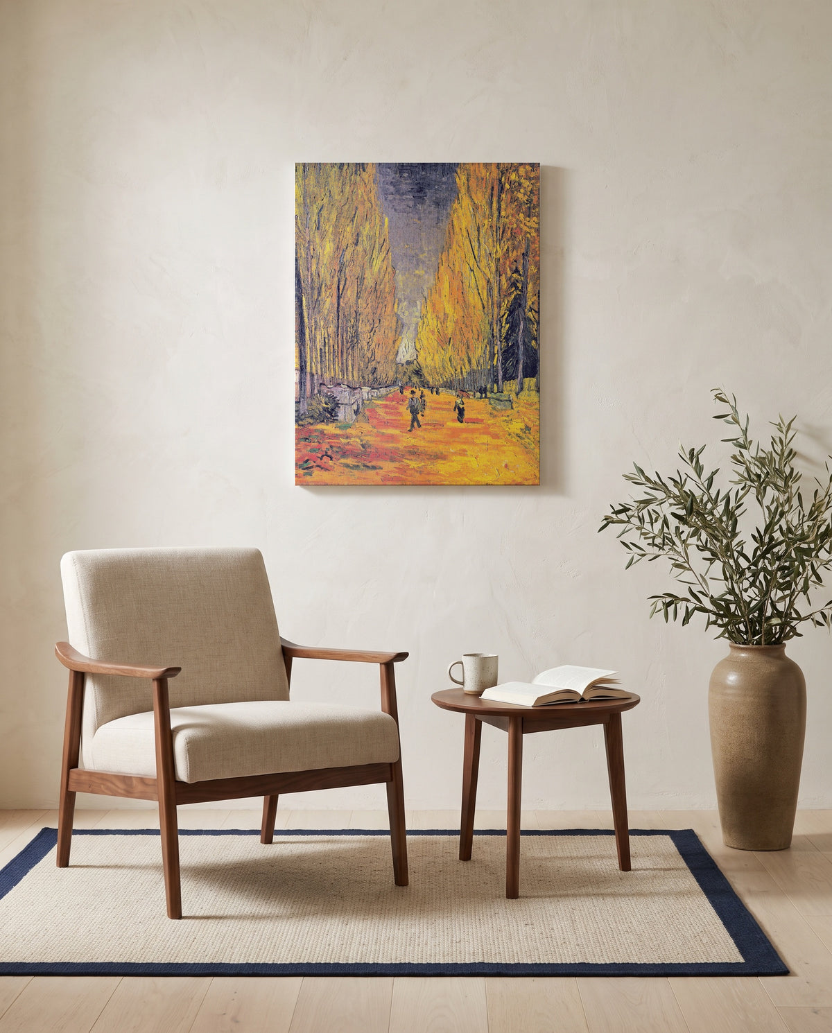 Les Alyscamps by Vincent van Gogh as a stretched canvas above a linen lounge chair in a reading corner