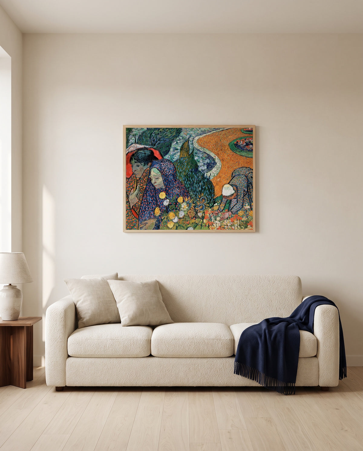 Memory of the Garden at Etten by Vincent van Gogh framed in natural oak above a cream sofa in a warm living room