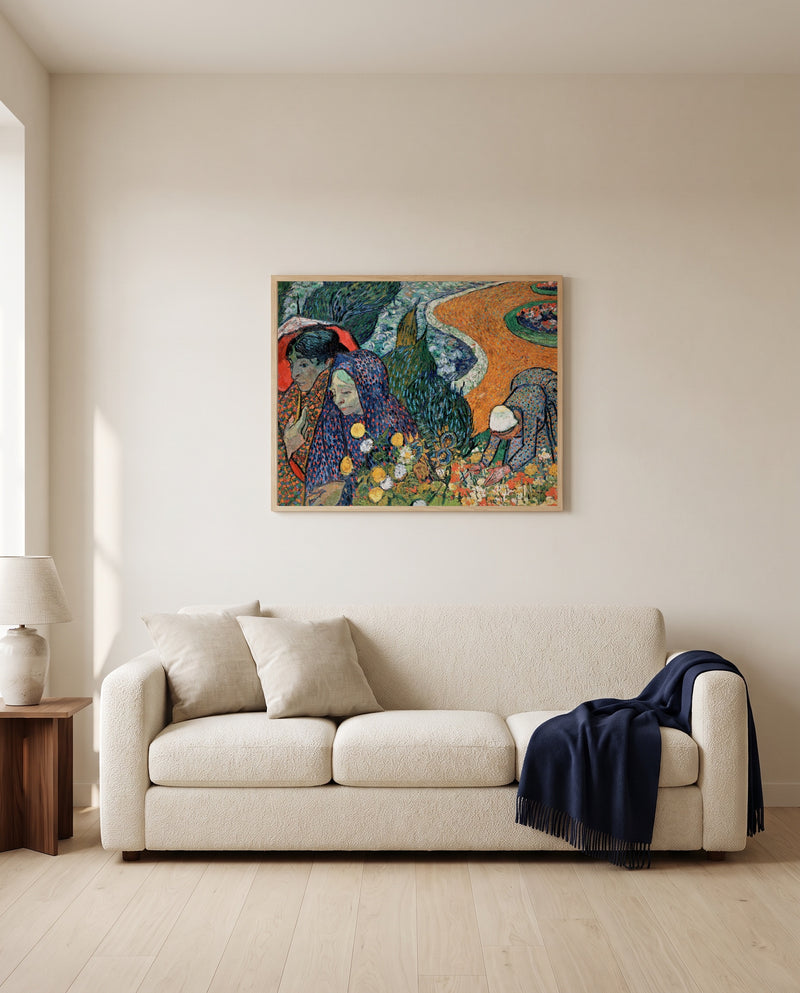 Memory of the Garden at Etten by Vincent van Gogh framed in natural oak above a cream sofa in a warm living room