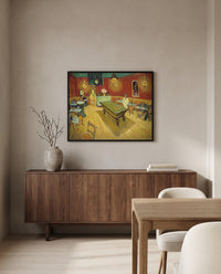 The Night Café by Vincent van Gogh in a black frame above a walnut sideboard in a dining room