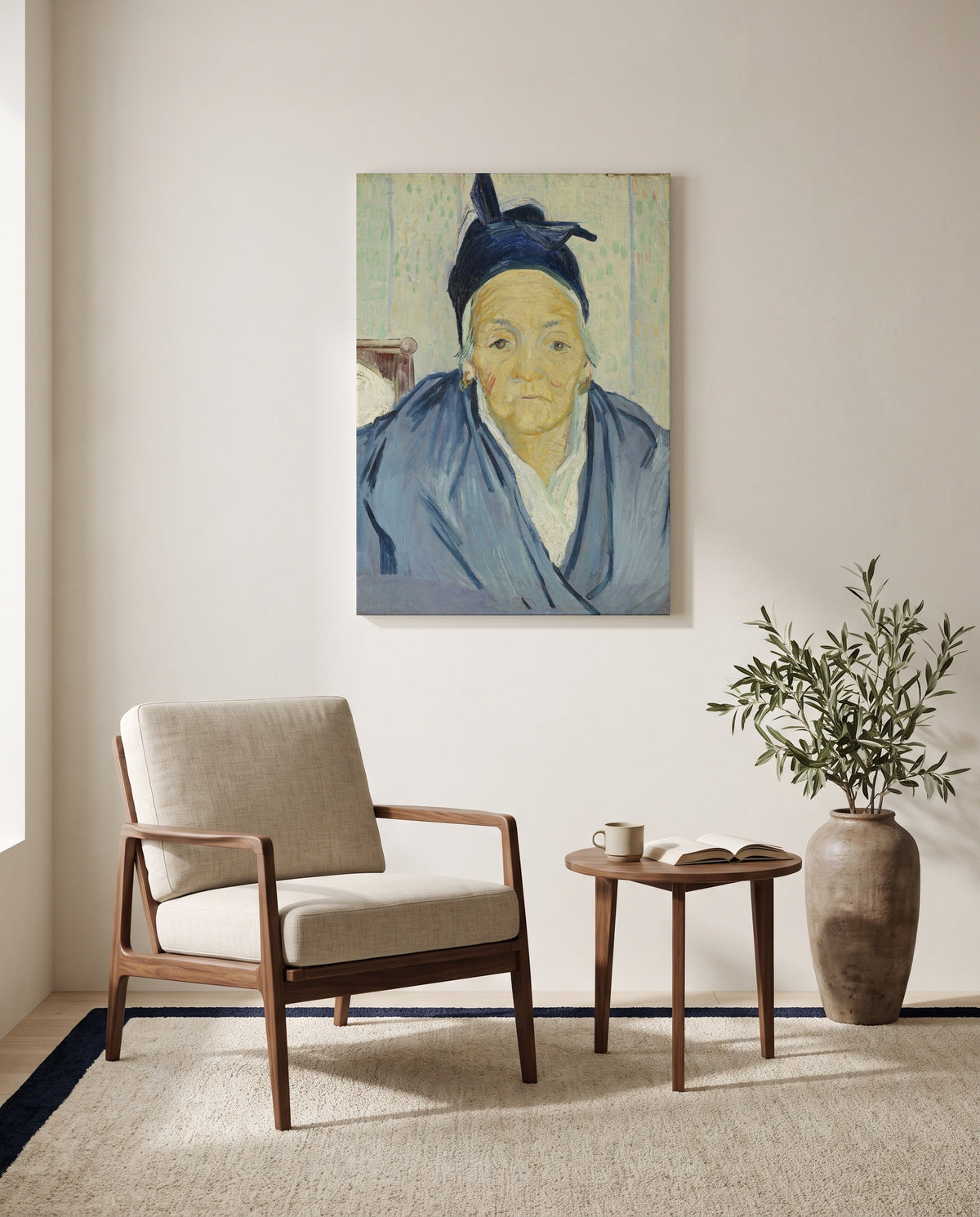 An Old Woman of Arles by Vincent van Gogh as a stretched canvas above a linen lounge chair in a reading corner