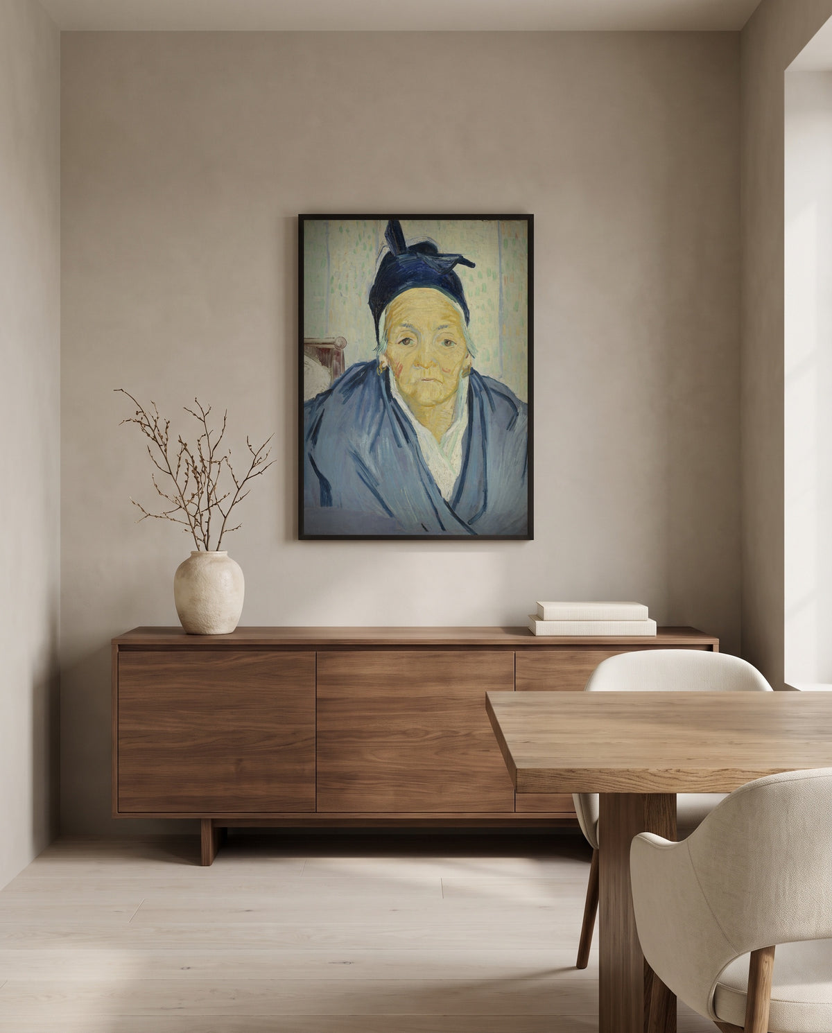 An Old Woman of Arles by Vincent van Gogh in a black frame above a walnut sideboard in a dining room