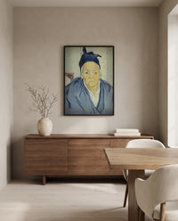 An Old Woman of Arles by Vincent van Gogh in a black frame above a walnut sideboard in a dining room