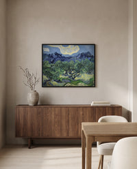 The Olive Trees by Vincent van Gogh in a black frame above a walnut sideboard in a dining room