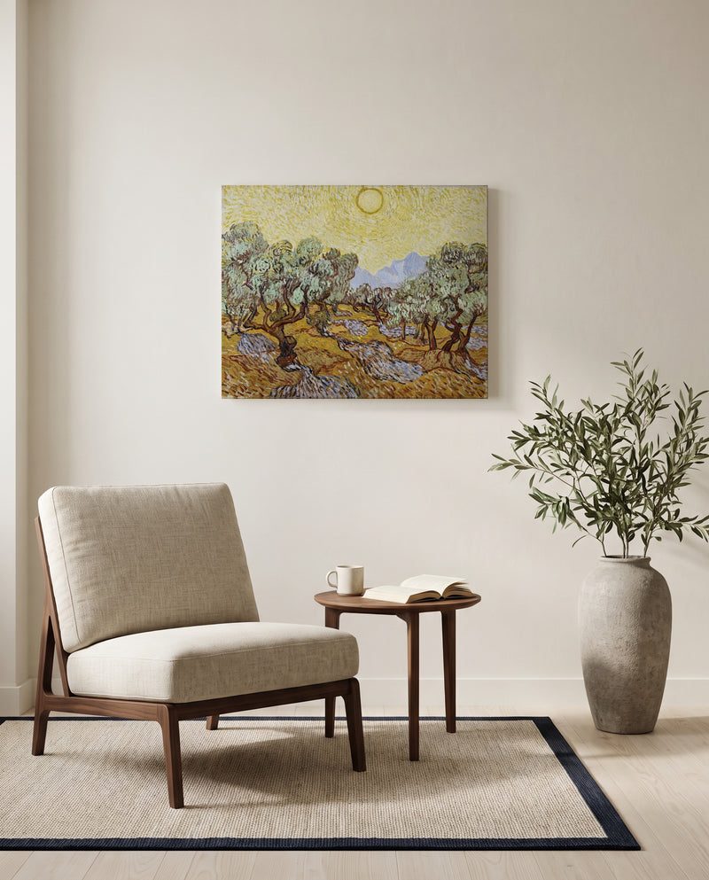 Olive Trees with Yellow Sky by Vincent van Gogh as a stretched canvas above a linen lounge chair in a reading corner
