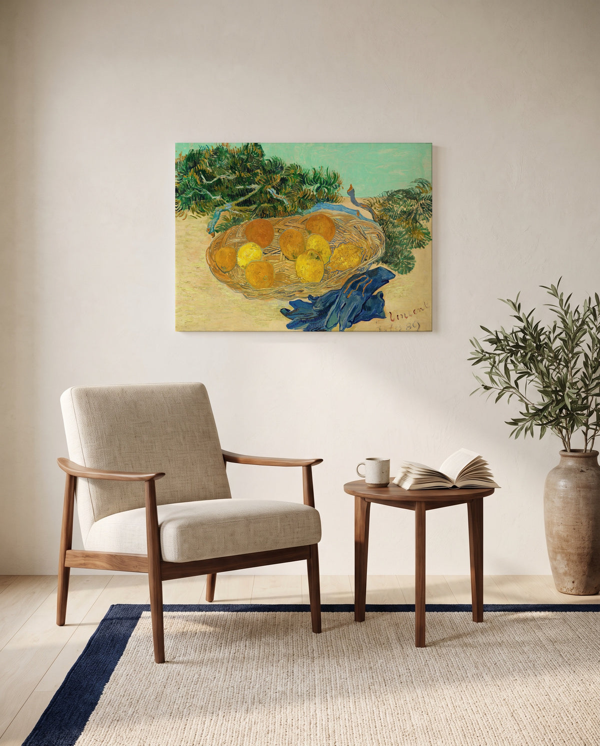 Oranges and Lemons with Blue Gloves by Vincent van Gogh as a stretched canvas above a linen lounge chair in a reading corner