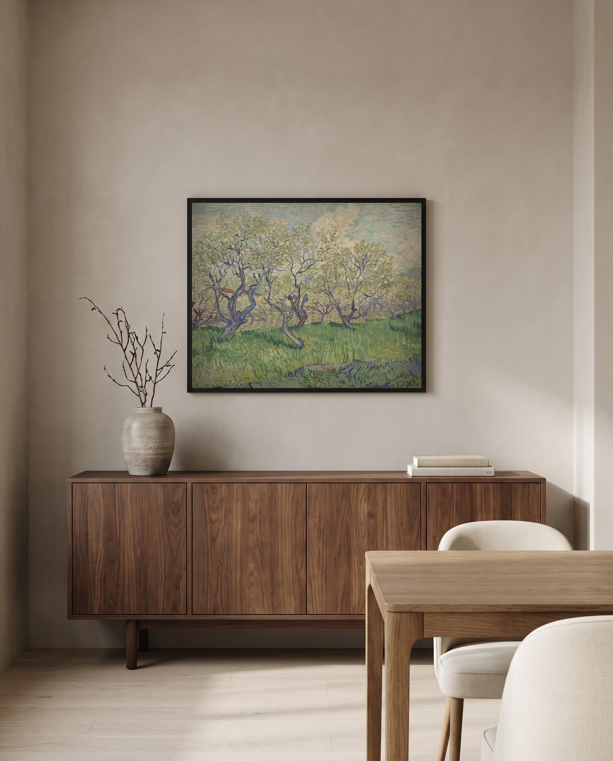 Orchard in Blossom, 1889 by Vincent van Gogh in a black frame above a walnut sideboard in a dining room