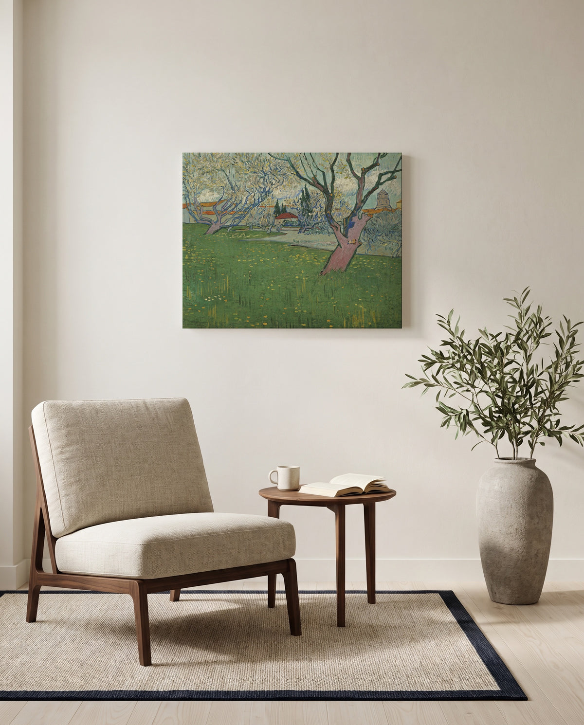 Orchards in Blossom, Arles by Vincent van Gogh as a stretched canvas above a linen lounge chair in a reading corner