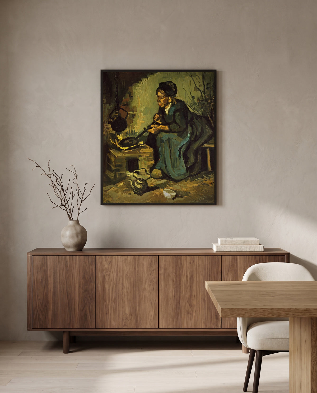Peasant Woman Cooking by Vincent van Gogh in a black frame above a walnut sideboard in a dining room