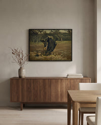 Peasant Woman Digging Up Potatoes by Vincent van Gogh in a black frame above a walnut sideboard in a dining room