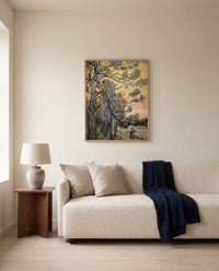 Pine Trees at Sunset by Vincent van Gogh framed in natural oak above a cream sofa in a warm living room