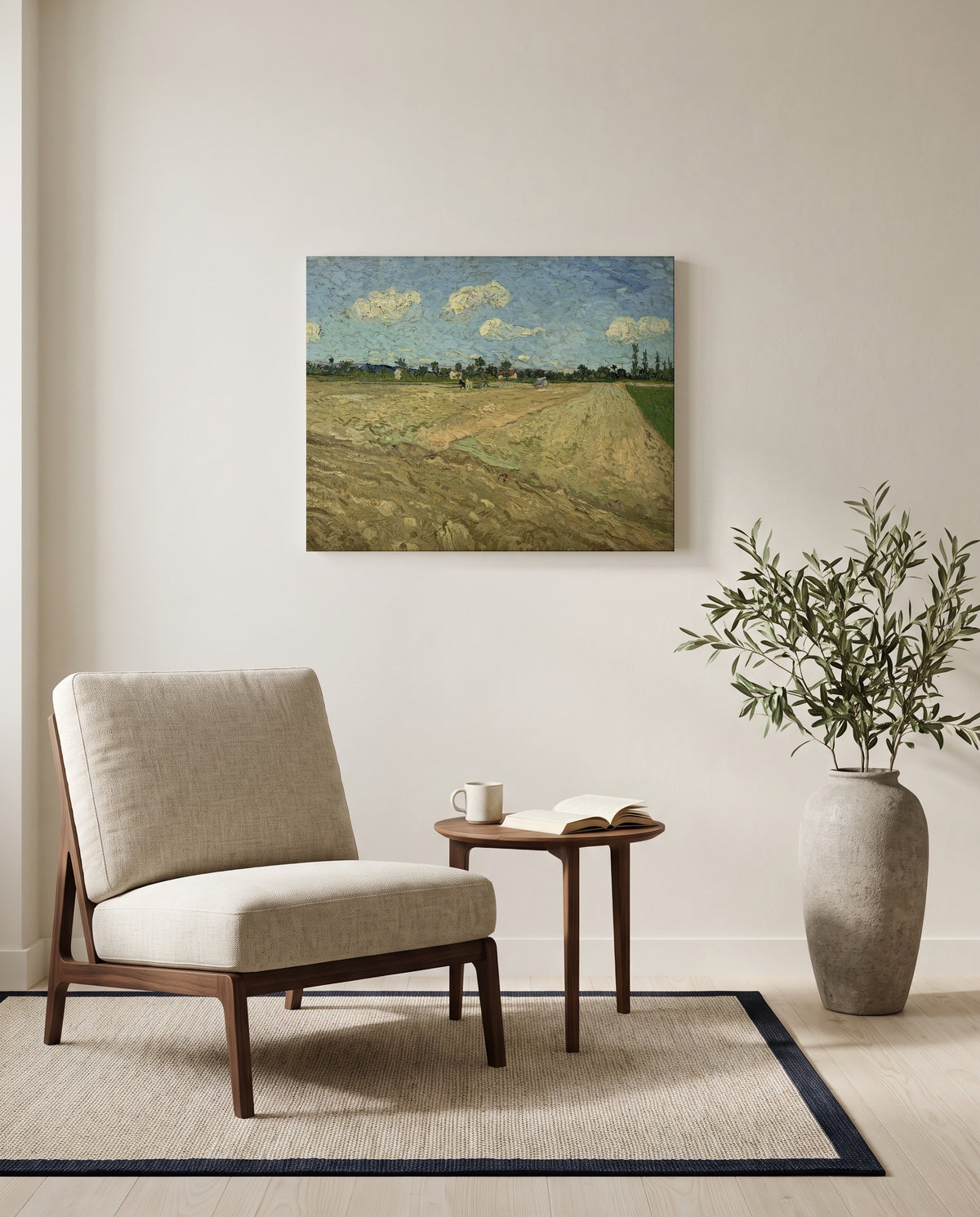Ploughed Fields by Vincent van Gogh as a stretched canvas above a linen lounge chair in a reading corner
