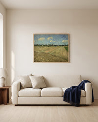 Ploughed Fields by Vincent van Gogh framed in natural oak above a cream sofa in a warm living room