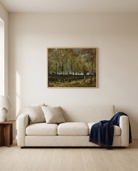 Poplars near Nuenen by Vincent van Gogh framed in natural oak above a cream sofa in a warm living room