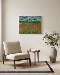 Poppy Field by Vincent van Gogh as a stretched canvas above a linen lounge chair in a reading corner