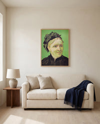 The Artist’s Mother by Vincent van Gogh framed in natural oak above a cream sofa in a warm living room