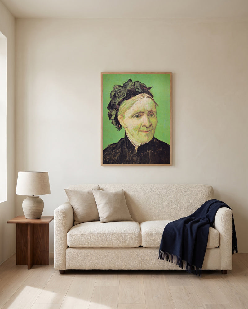 The Artist’s Mother by Vincent van Gogh framed in natural oak above a cream sofa in a warm living room