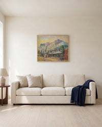 Restaurant de la Sirène by Vincent van Gogh framed in natural oak above a cream sofa in a warm living room