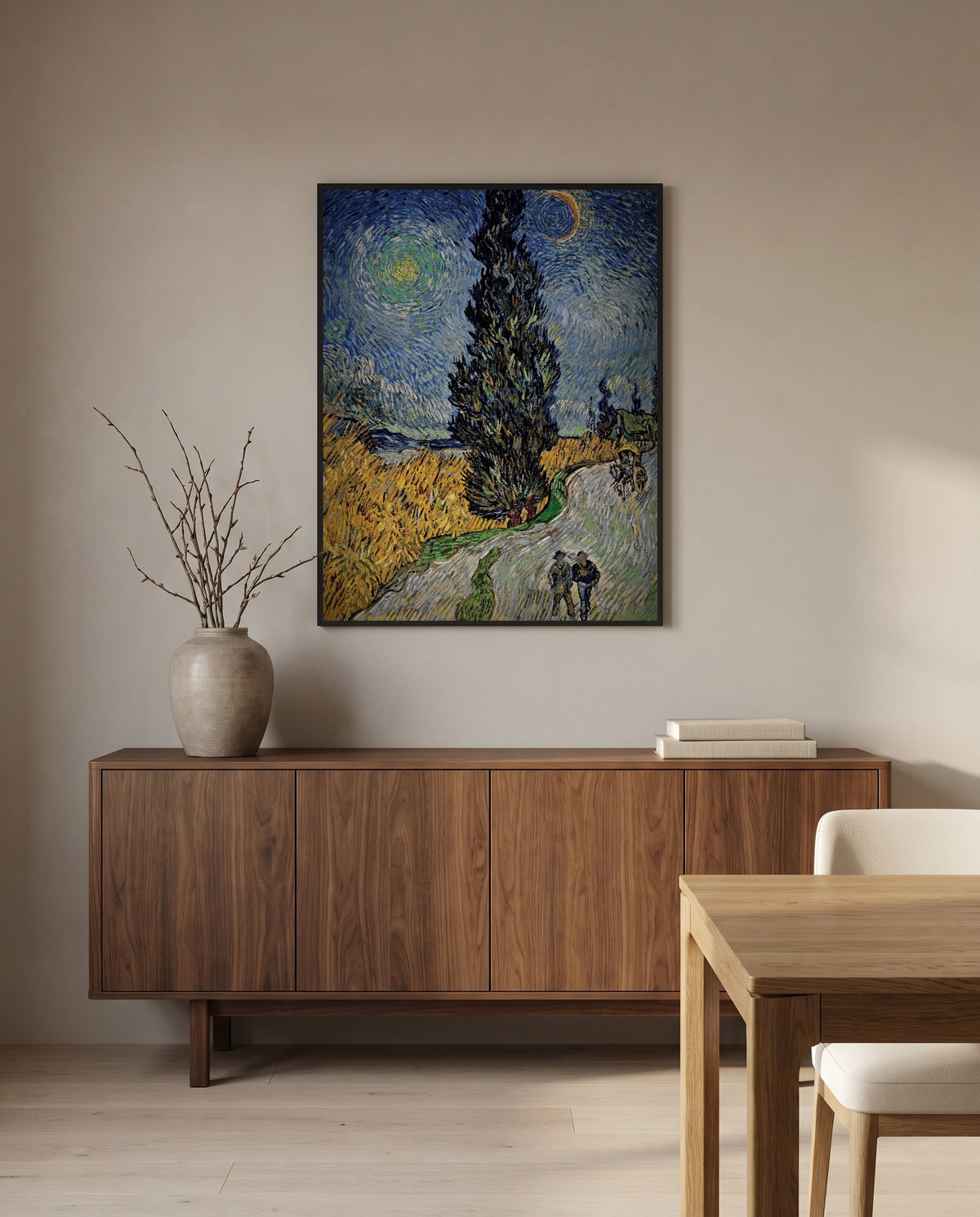 Road with Cypress and Star by Vincent van Gogh in a black frame above a walnut sideboard in a dining room