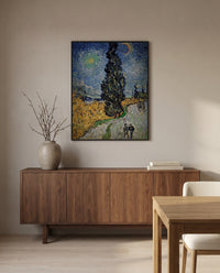 Road with Cypress and Star by Vincent van Gogh in a black frame above a walnut sideboard in a dining room