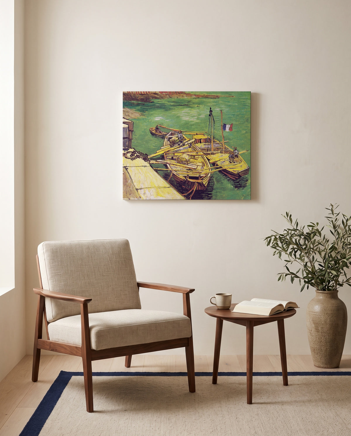 Sand Barges by Vincent van Gogh as a stretched canvas above a linen lounge chair in a reading corner