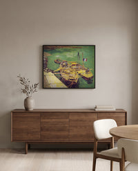 Sand Barges by Vincent van Gogh in a black frame above a walnut sideboard in a dining room