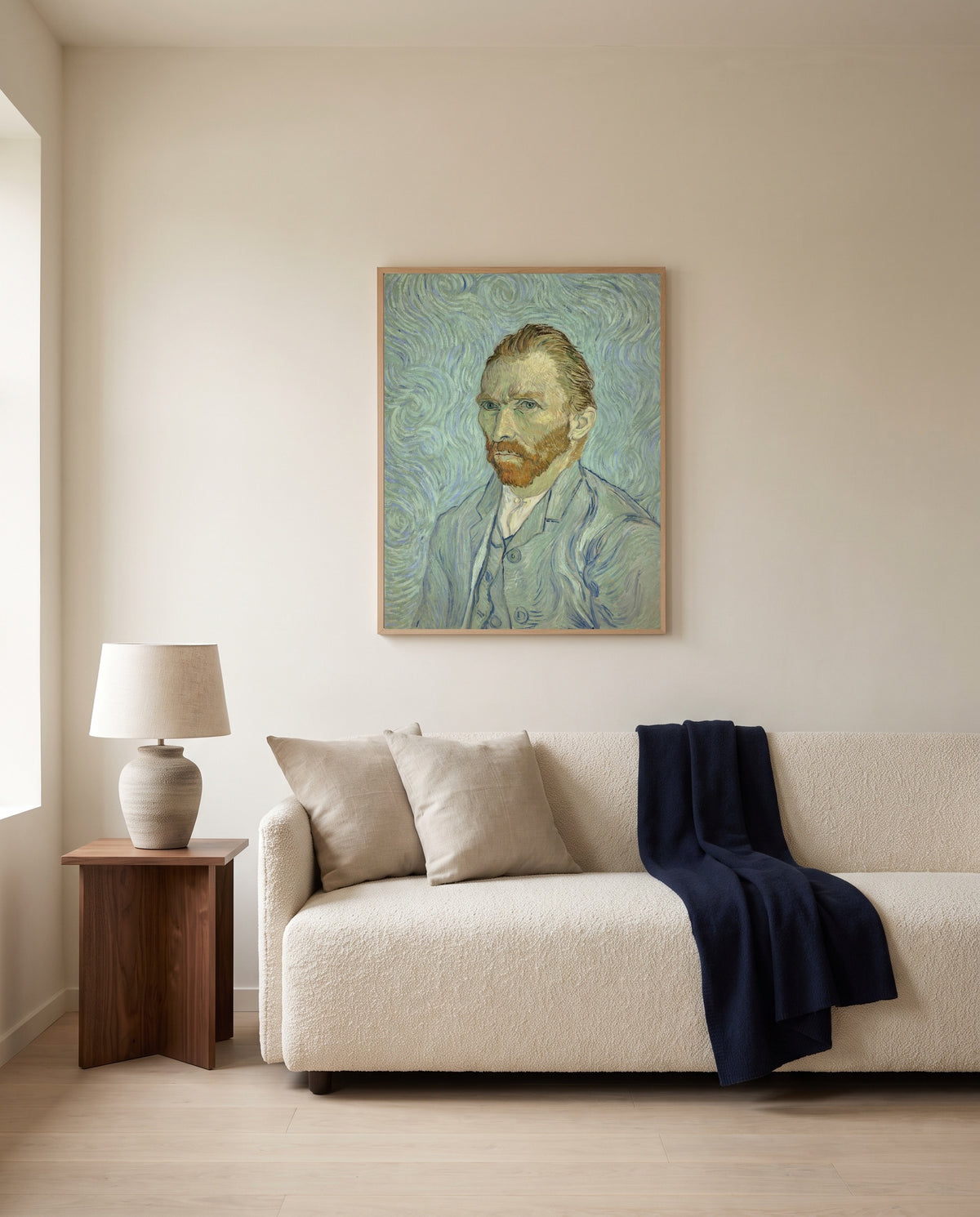 Self-Portrait, 1889 by Vincent van Gogh framed in natural oak above a cream sofa in a warm living room