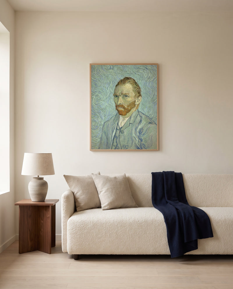 Self-Portrait, 1889 by Vincent van Gogh framed in natural oak above a cream sofa in a warm living room