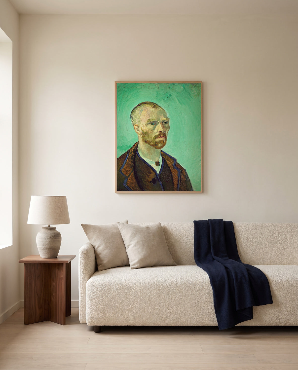 Self-Portrait for Gauguin by Vincent van Gogh framed in natural oak above a cream sofa in a warm living room