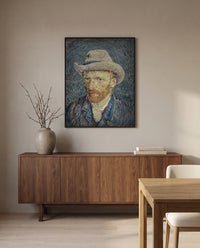Self-Portrait with Grey Felt Hat by Vincent van Gogh in a black frame above a walnut sideboard in a dining room